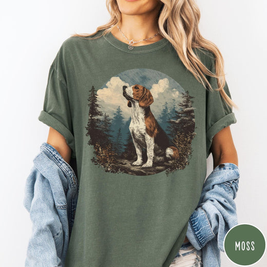 Comfort Colors tee in Moss featuring vintage style graphic of a beagle sitting in a forest scene