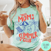 Comfort Colors tee in Island Reef featuring beach vacation style graphic with sun, umbrella, palm tree, and bag