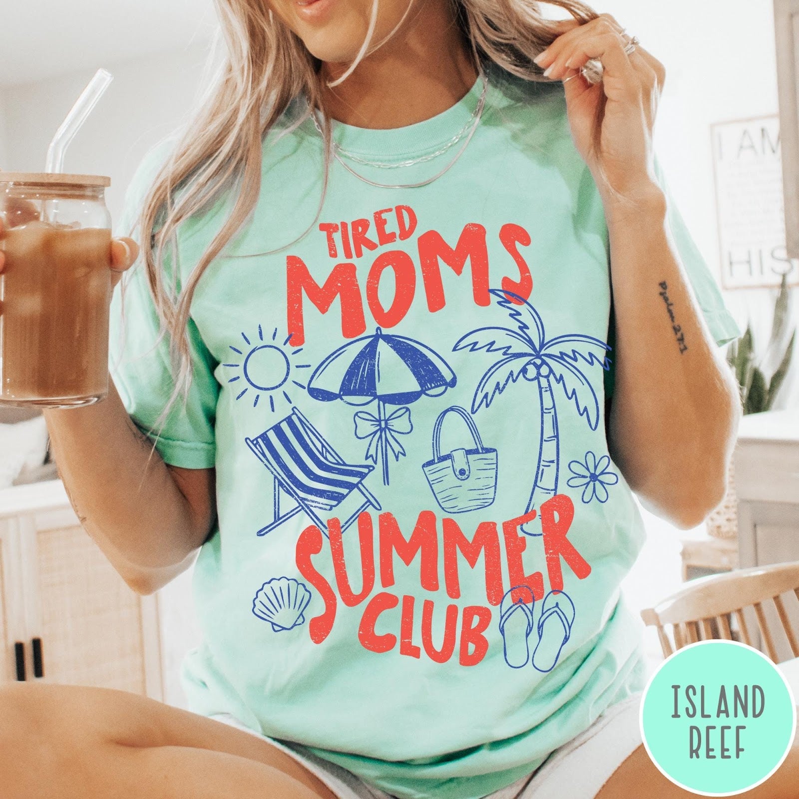 Comfort Colors tee in Island Reef featuring beach vacation style graphic with sun, umbrella, palm tree, and bag