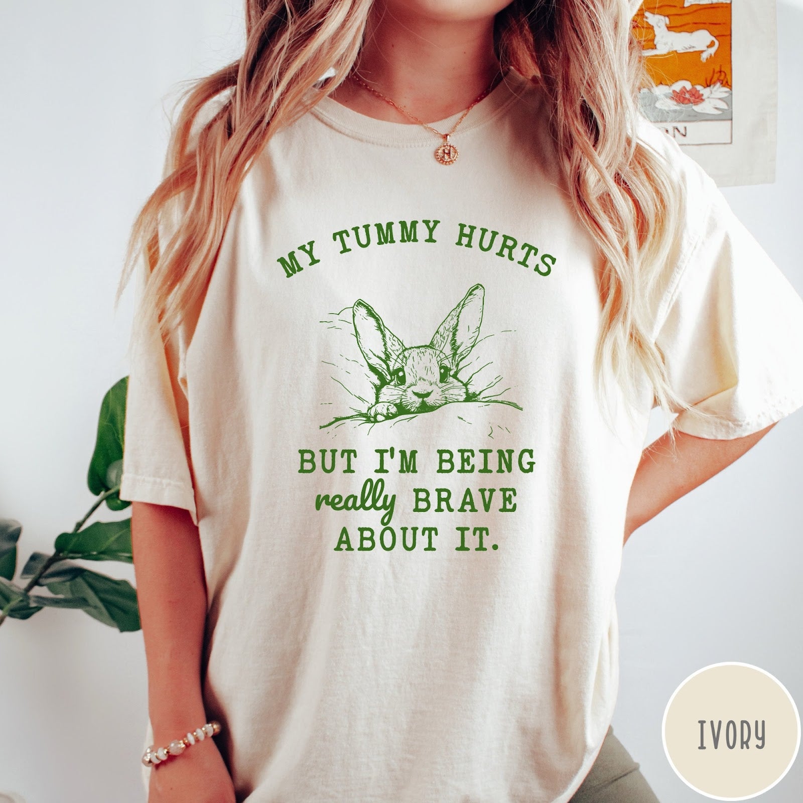 Comfort Colors tee in Ivory featuring line art graphic of a bunny with text My Tummy Hurts