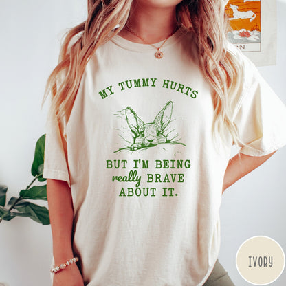 Comfort Colors tee in Ivory featuring line art graphic of a bunny with text My Tummy Hurts