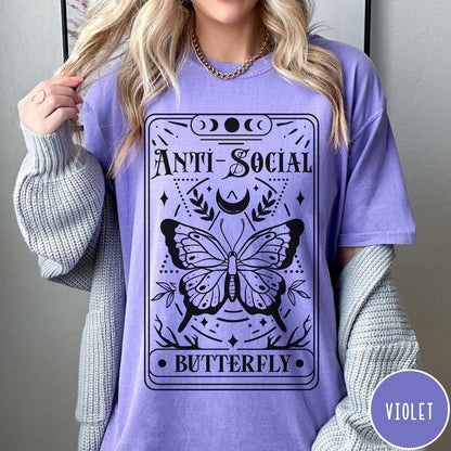 Comfort Colors tee in Violet featuring tarot card style graphic with butterfly and celestial moon phase design