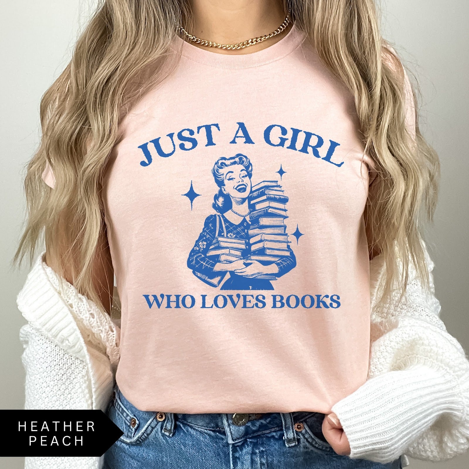Comfort Colors tee in Heather Peach featuring vintage style graphic of a girl holding a stack of books