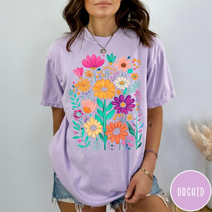 Comfort Colors tee in Orchid featuring boho style floral graphic with vibrant orange, pink, and purple flowers