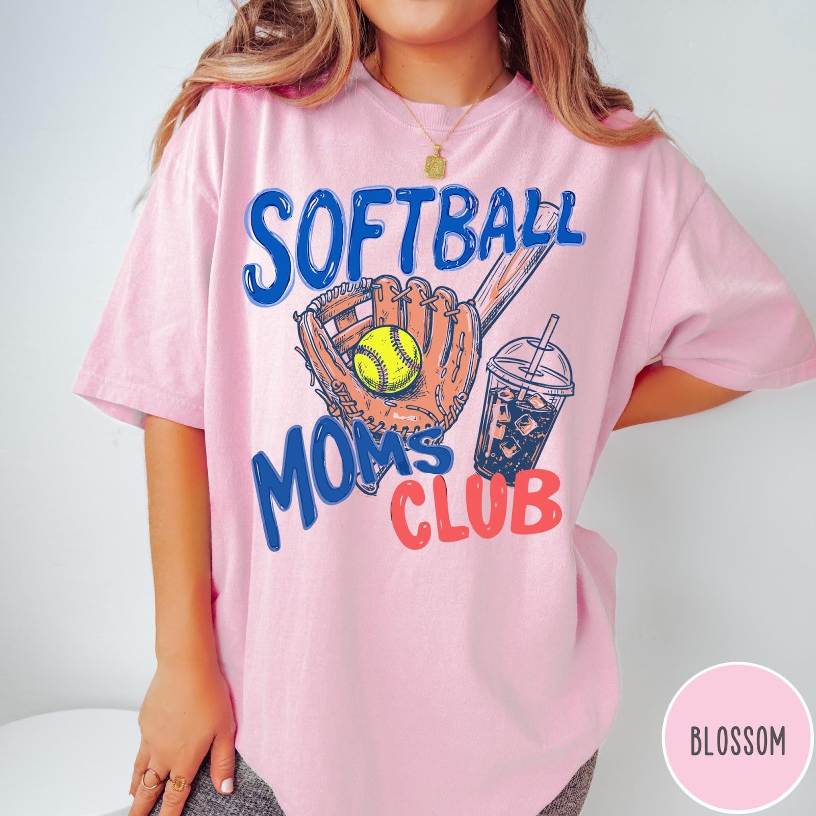 Comfort Colors tee in Blossom featuring softball mom life graphic with baseball glove, ball, and iced coffee