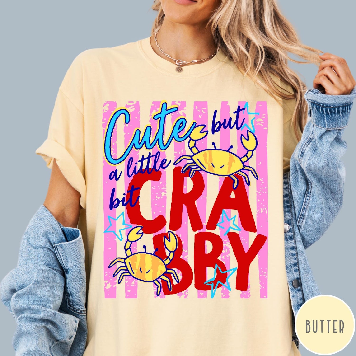 Comfort Colors tee in Butter featuring graphic design with crabs and text reading Cute but a little bit Crabby