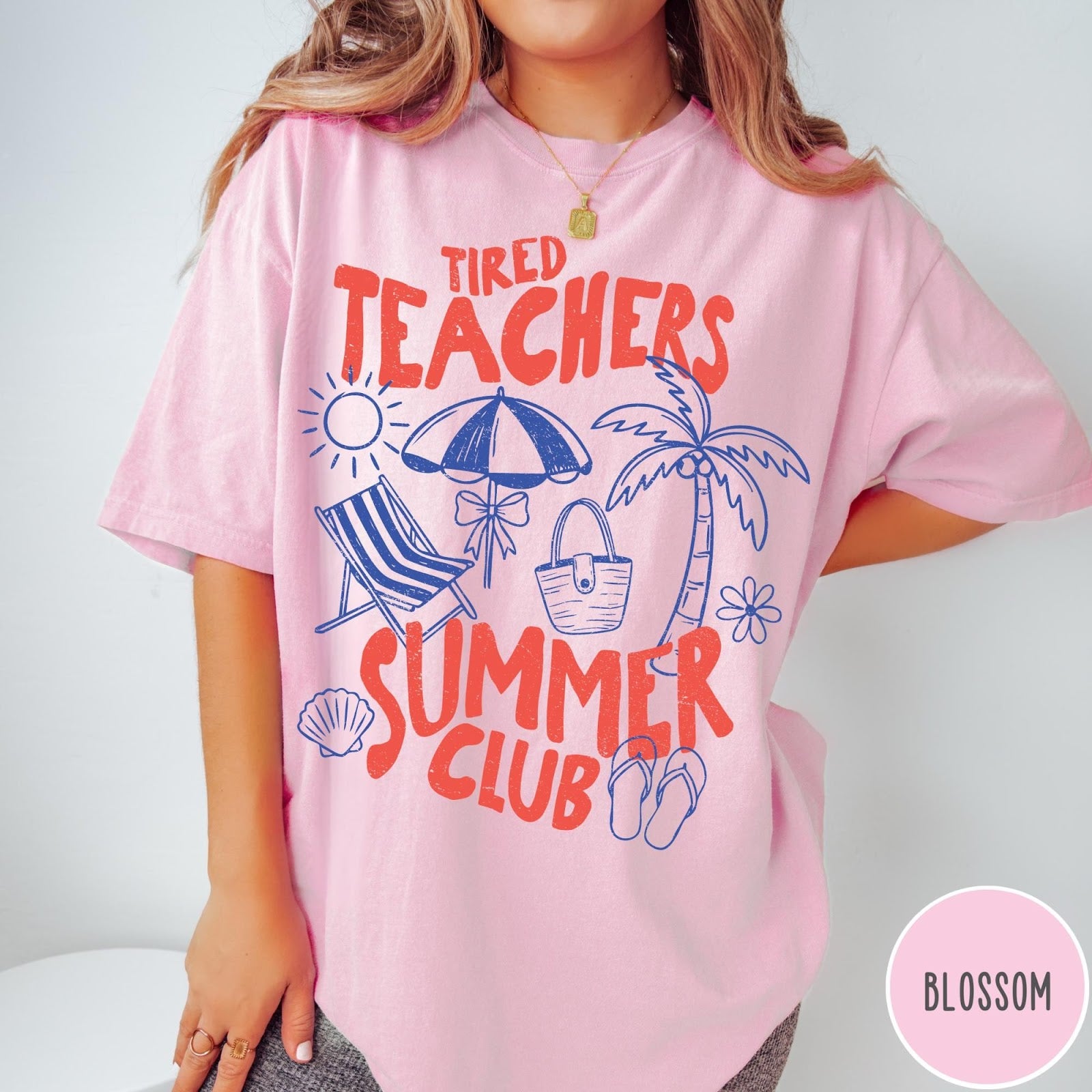 Comfort Colors tee in Blossom featuring summer vacation design with beach umbrella, palm tree, and sun graphics