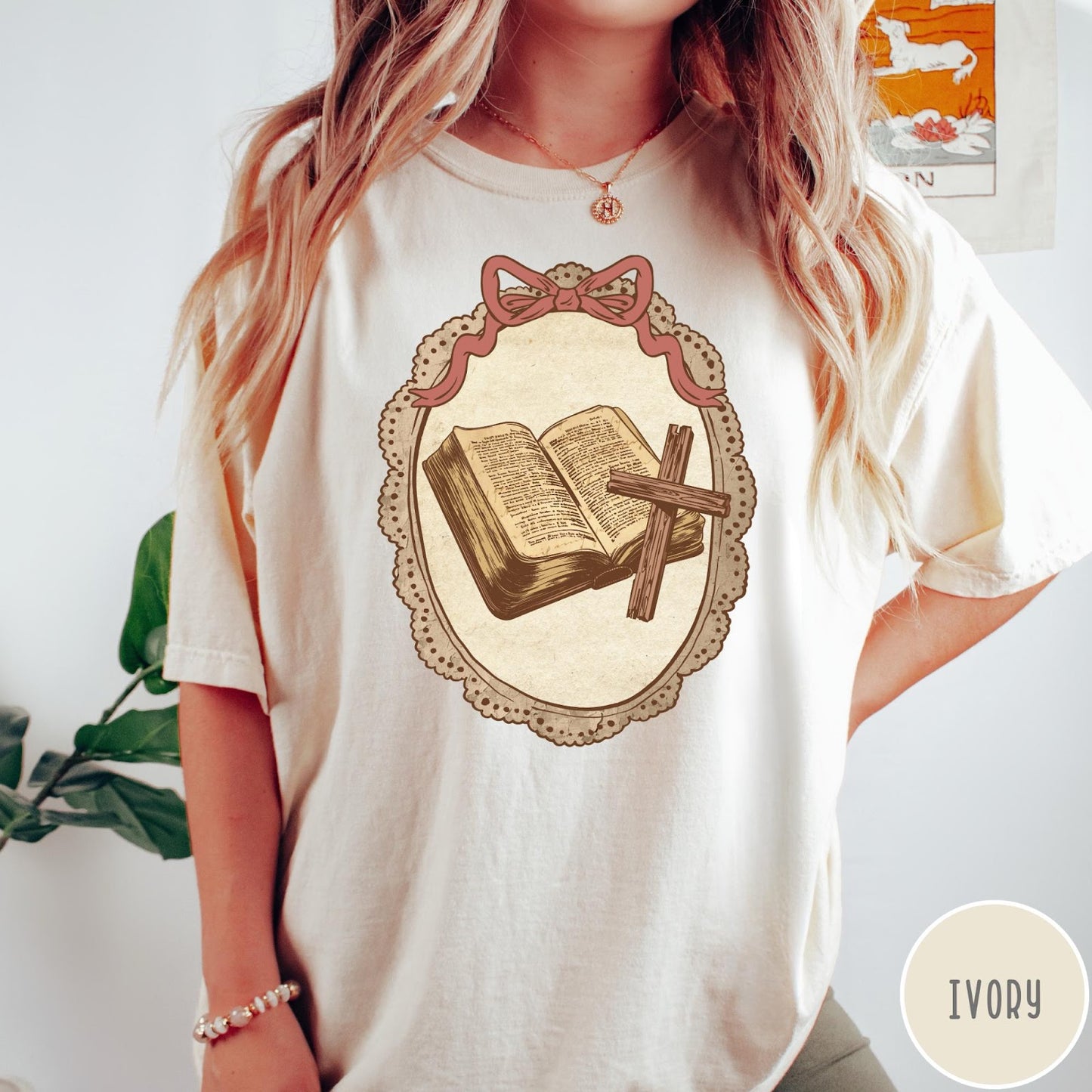 Comfort Colors tee in Ivory featuring vintage style graphic of an open Bible and wooden cross