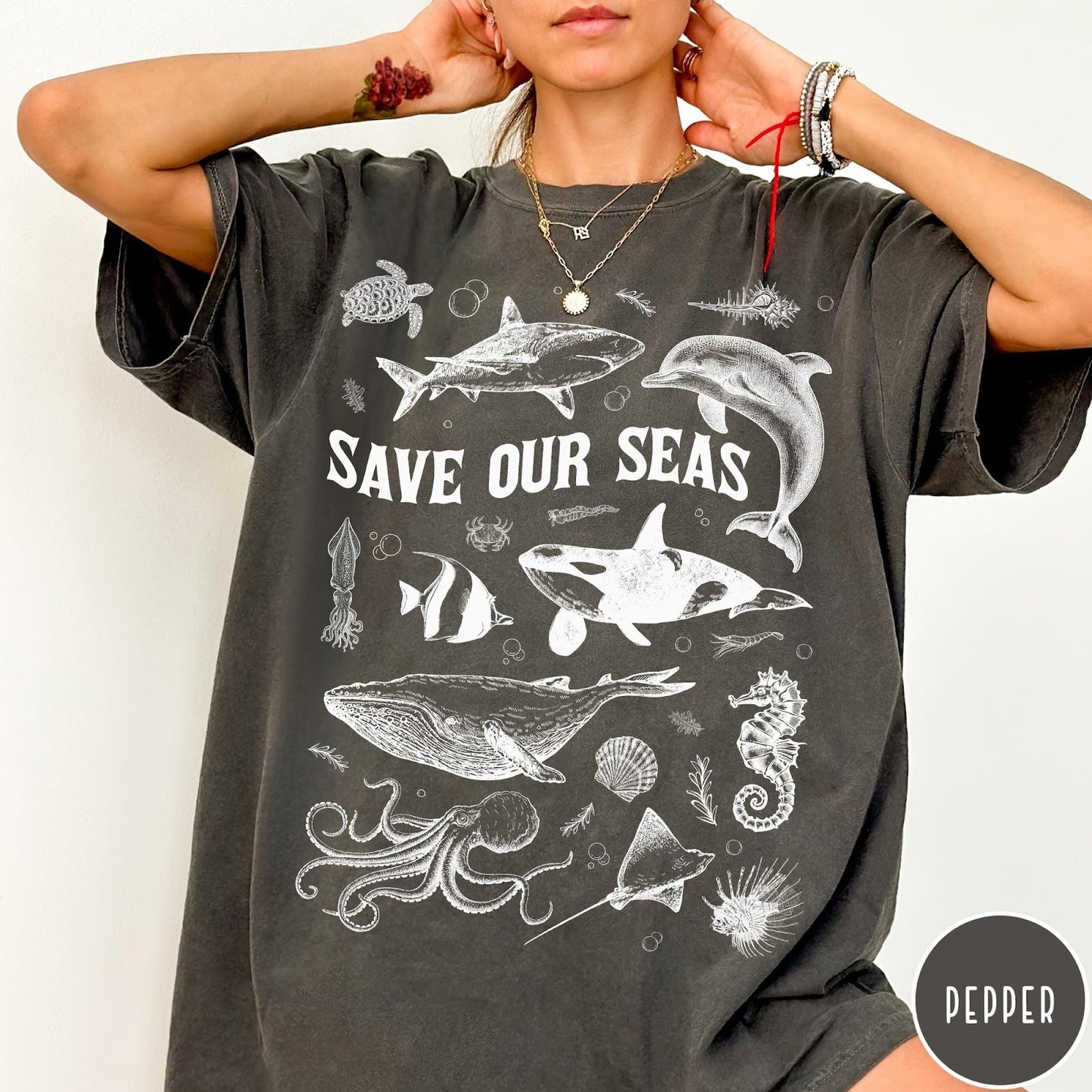 Comfort Colors tee in Pepper featuring line art marine life graphic with Save Our Seas text design
