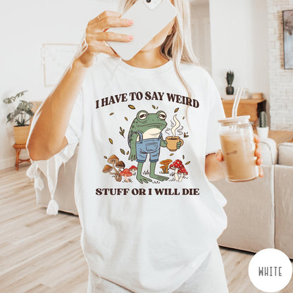 Comfort Colors tee in White featuring cartoon style frog wearing overalls holding a coffee mug with mushrooms