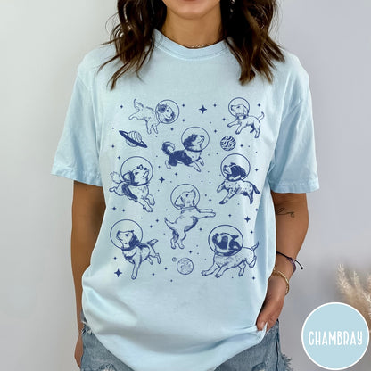 Comfort Colors tee in Chambray featuring space theme graphic with various dogs wearing astronaut helmets and planets