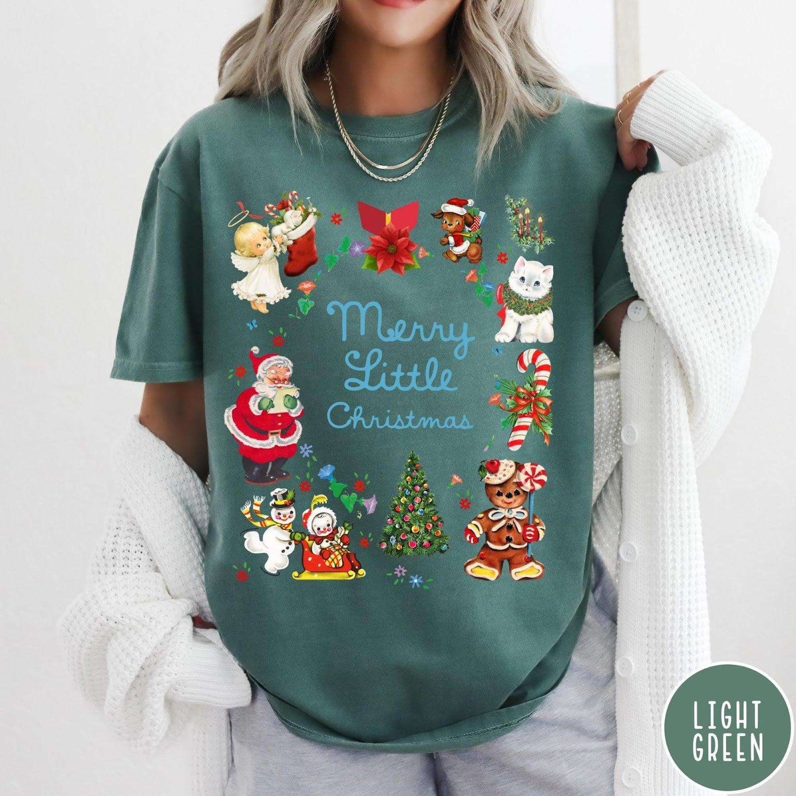 Comfort Colors tee in Light Green featuring vintage style holiday characters including Santa, a snowman, and gingerbread man.