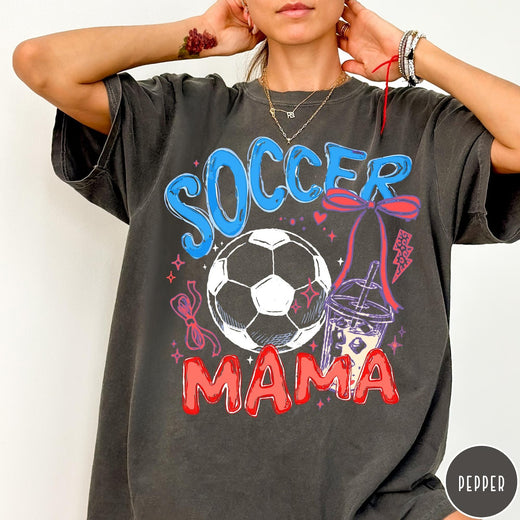 Comfort Colors tee in Pepper featuring soccer graphic with a soccer ball, iced coffee, and red bow