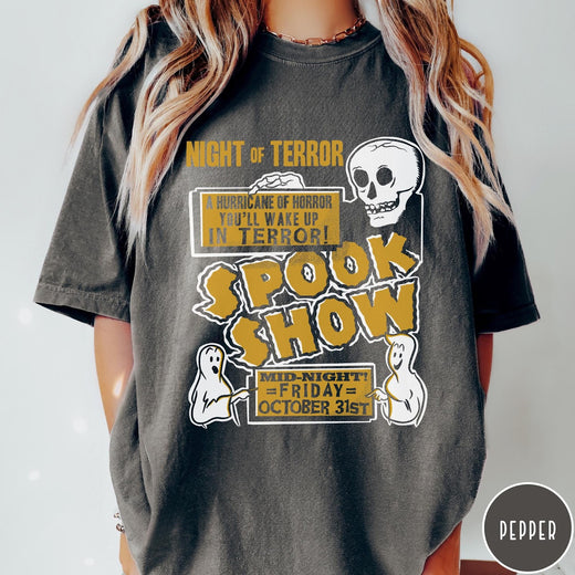 Comfort Colors tee in Pepper featuring retro horror movie poster graphic with skull and spooky ghost illustrations