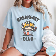 Comfort Colors tee in Chambray featuring retro style graphic of a pancake character with syrup and peace sign