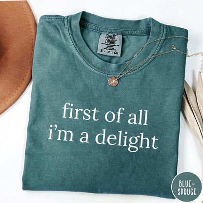 Comfort Colors tee in Blue Spruce featuring typography graphic reading first of all i'm a delight in white