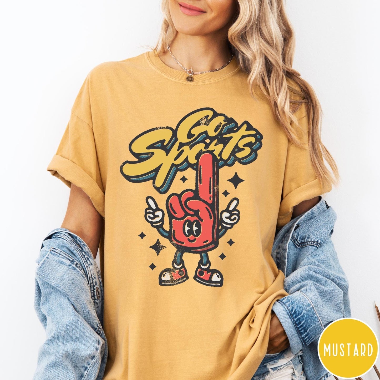 Comfort Colors tee in Mustard featuring retro mascot design with a red foam finger character and text