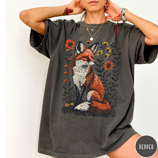 Comfort Colors tee in Pepper featuring vintage style graphic of a sitting fox surrounded by orange flowers