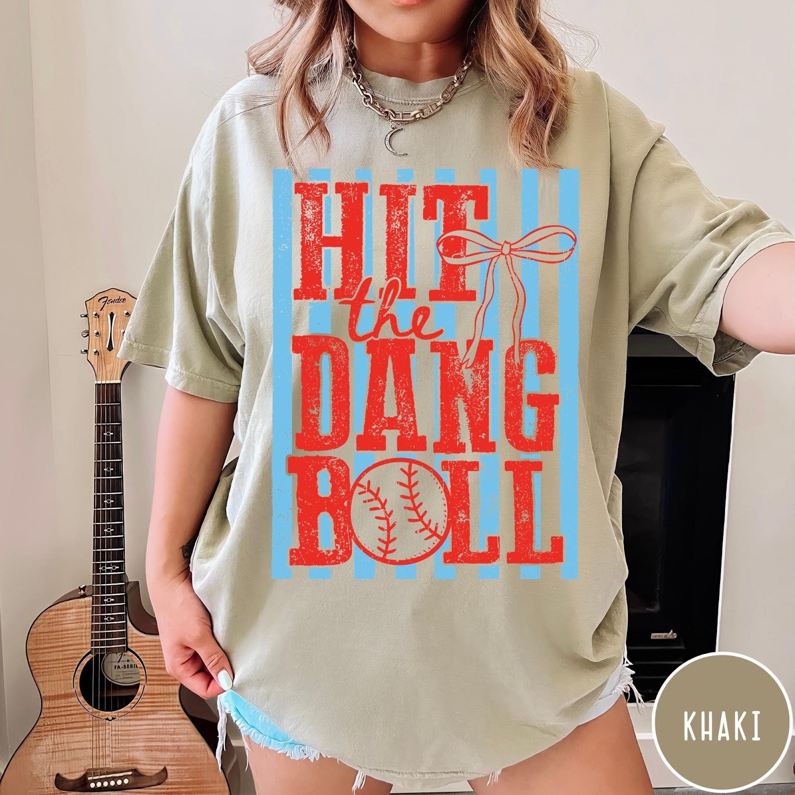 Comfort Colors tee in Khaki featuring baseball graphic with red text and blue stripes and a bow