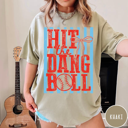 Comfort Colors tee in Khaki featuring baseball graphic with red text and blue stripes and a bow