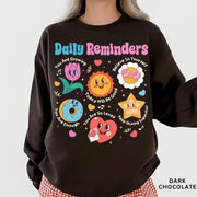 Comfort Colors tee in Dark Chocolate featuring retro mascot design with daily affirmations and colorful graphics
