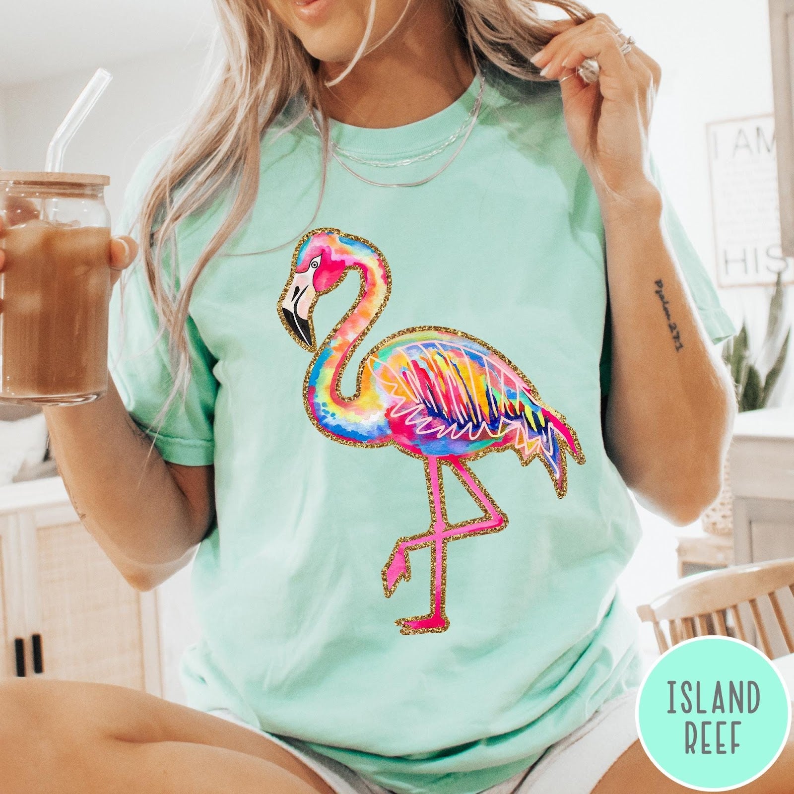 Comfort Colors tee in Island Reef featuring artistic watercolor flamingo graphic with gold glitter outline details