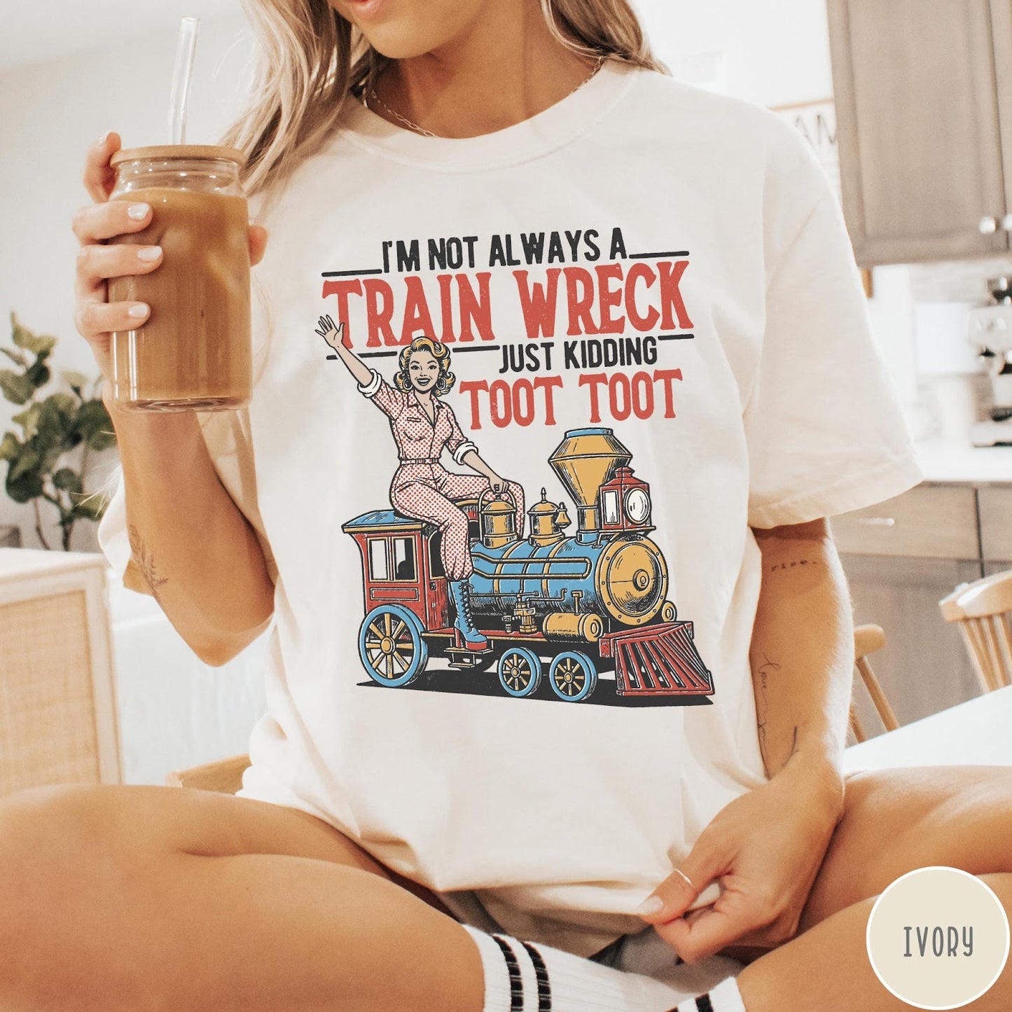 Comfort Colors tee in Ivory featuring vintage pin-up style graphic of a woman riding a steam train