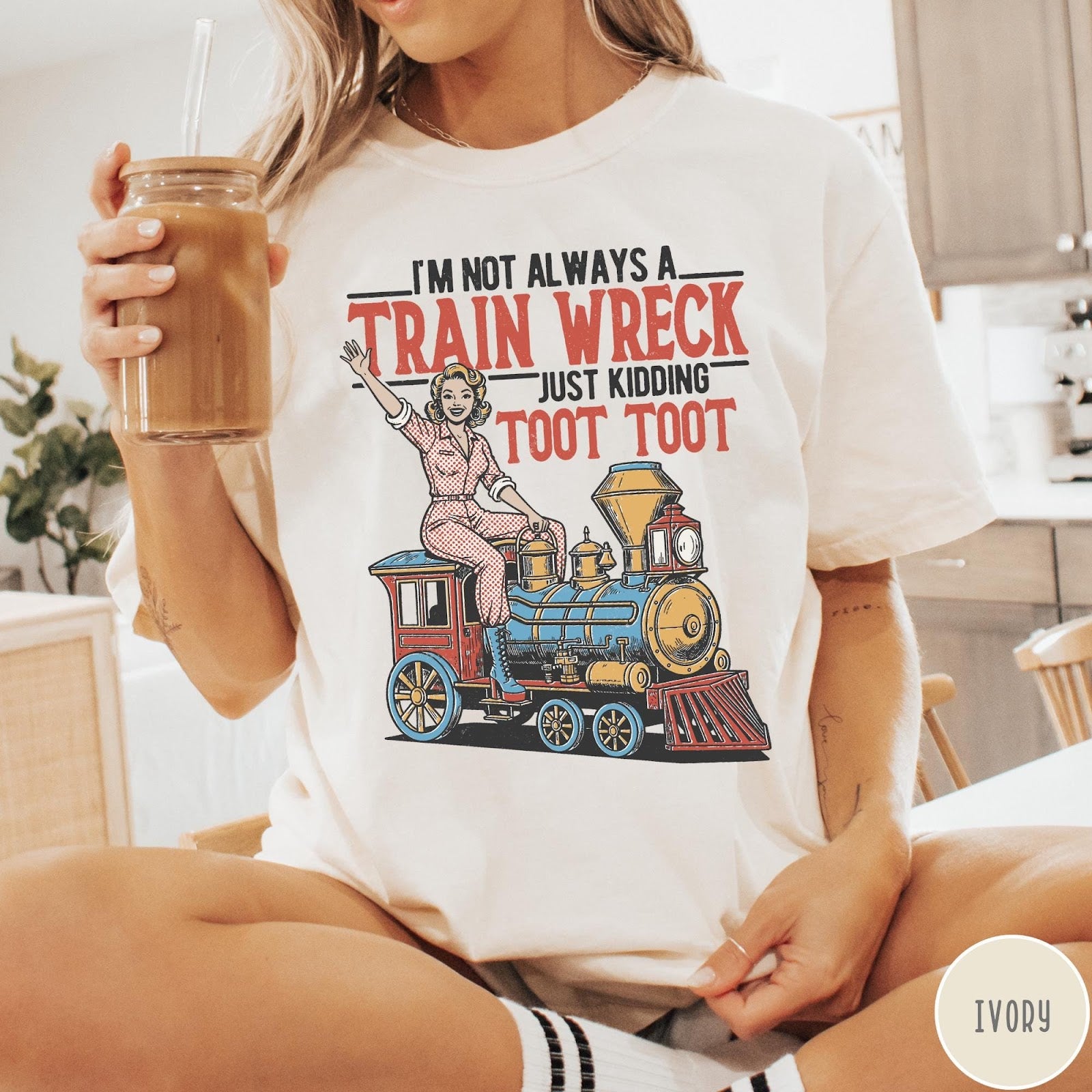 Comfort Colors tee in Ivory featuring vintage pin-up style graphic of a woman riding a steam train