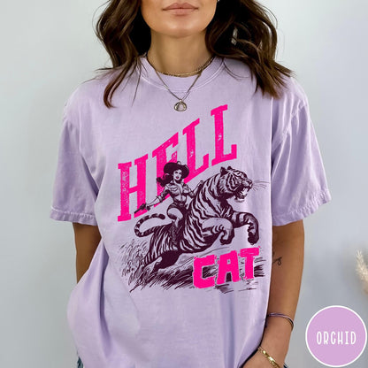 Comfort Colors tee in Orchid featuring retro design of a cowgirl riding a tiger with pink text