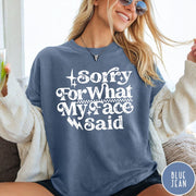 Comfort Colors tee in Blue Jean featuring sarcastic expression graphic with Sorry For What My Face Said text