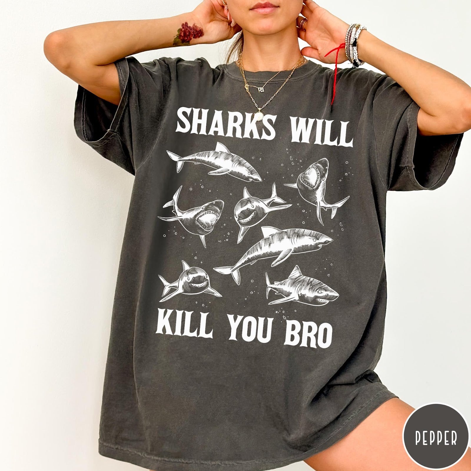 Comfort Colors tee in Pepper featuring illustrative style graphic of multiple sharks and text Sharks Will Kill You