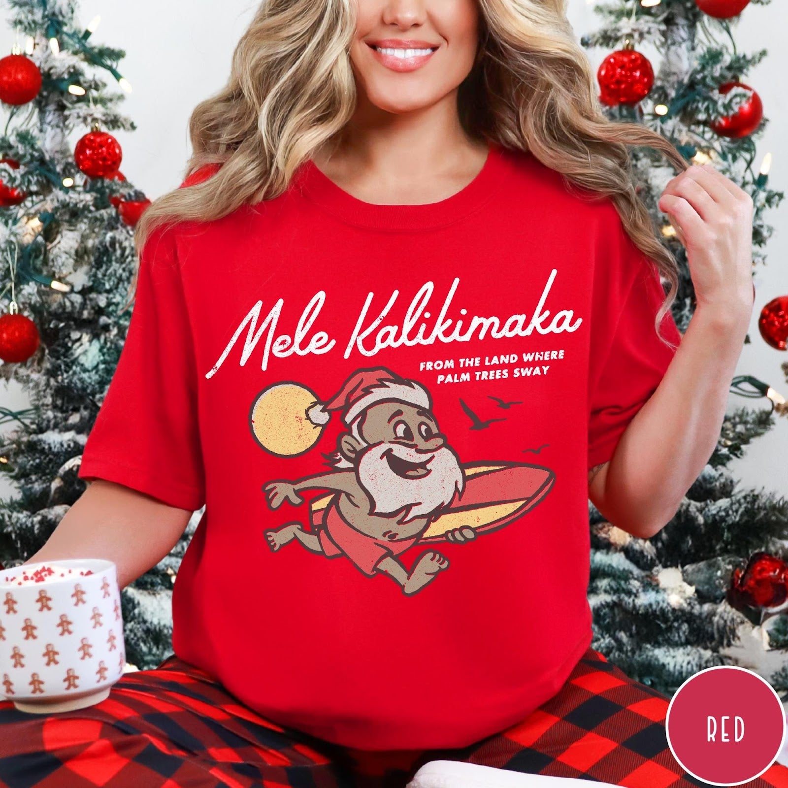 Comfort Colors tee in Red featuring vintage style graphic of a surfing Santa Claus on vacation