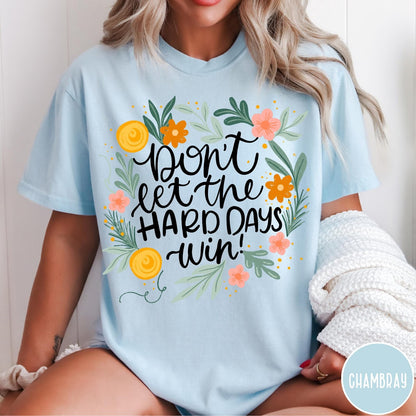 Comfort Colors tee in Chambray featuring floral design with mental health encouragement text Don't Let The Hard Days Win