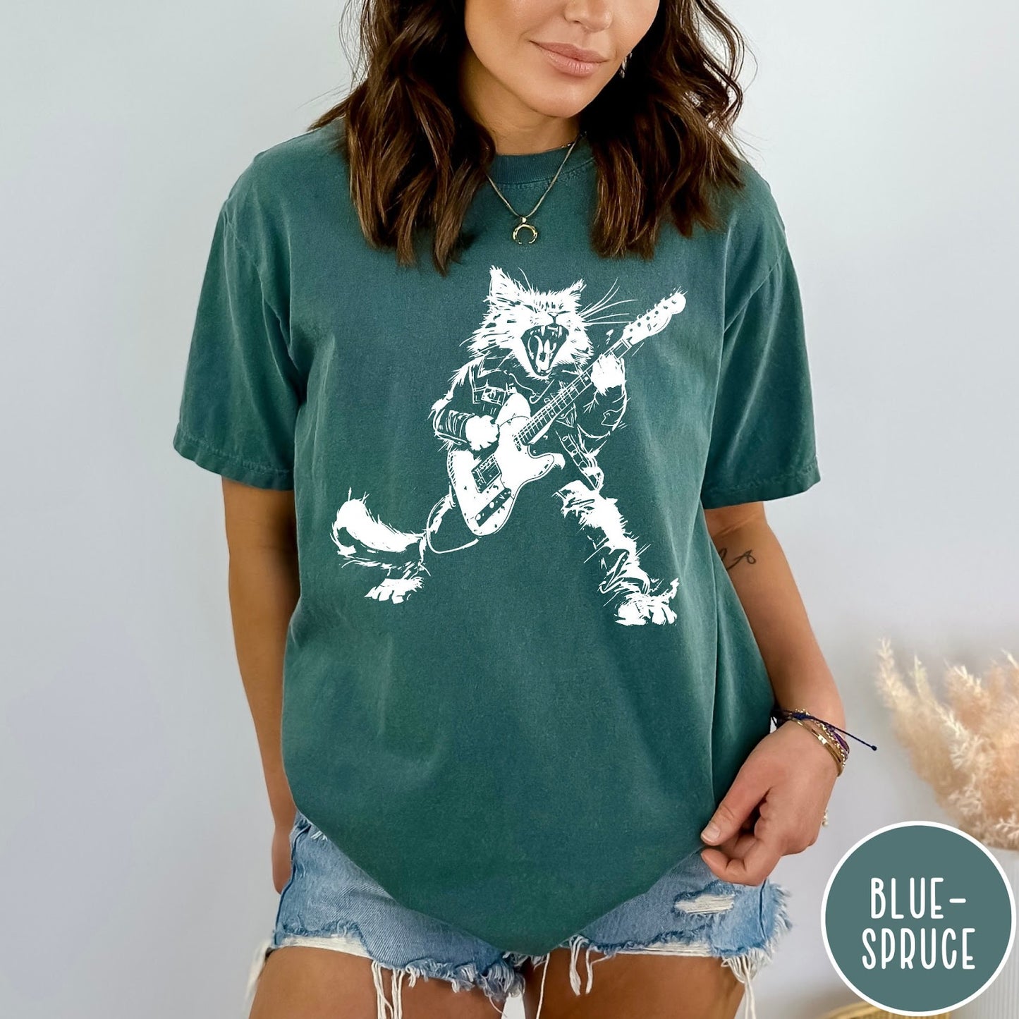 Comfort Colors tee in Blue Spruce featuring rock music style graphic of a cat playing an electric guitar
