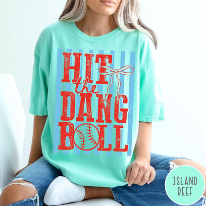 Comfort Colors tee in Island Reef featuring baseball design with red text and a blue striped background graphic