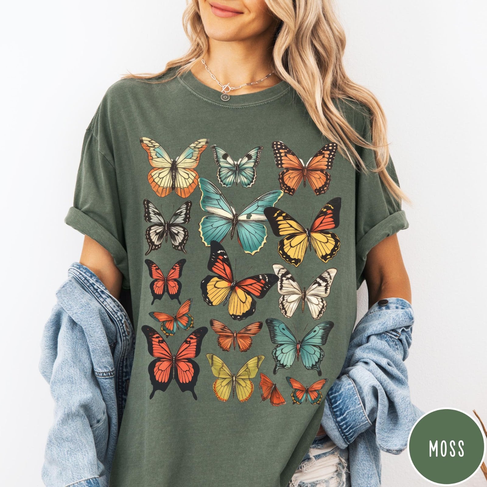 Comfort Colors tee in Moss featuring butterfly collection design with various colorful butterfly illustrations in a grid