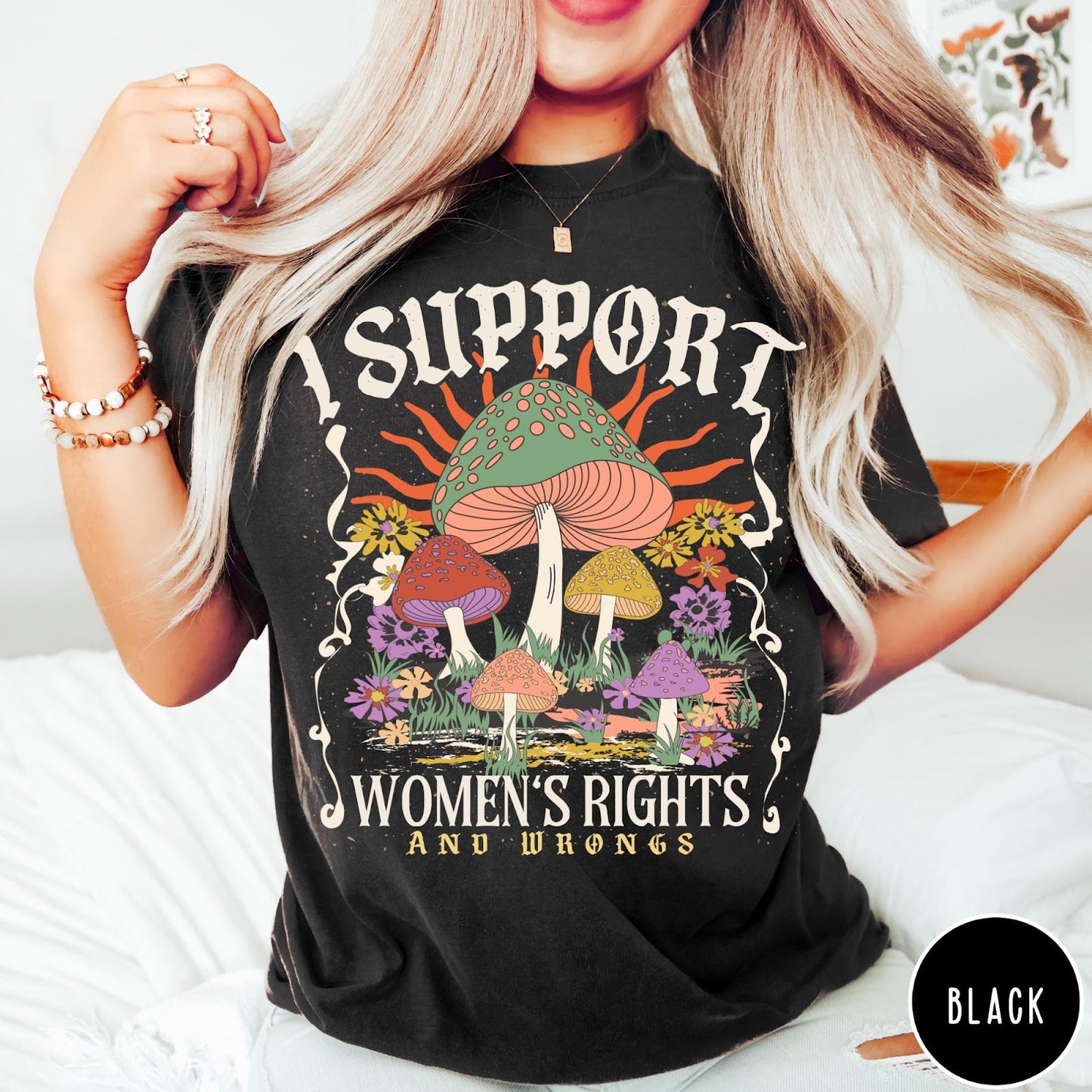 Comfort Colors tee in Black featuring retro graphic design with colorful mushrooms, flowers, and sun illustration