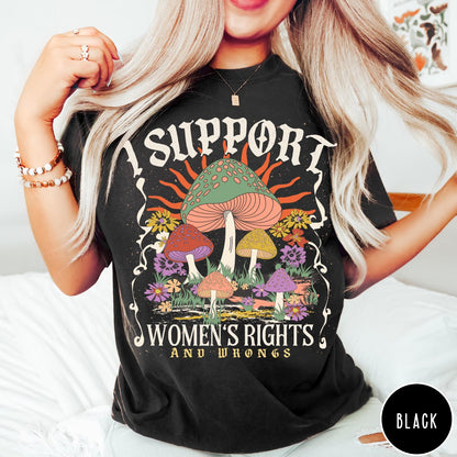 Comfort Colors tee in Black featuring retro graphic design with colorful mushrooms, flowers, and sun illustration