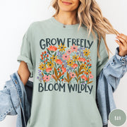 Comfort Colors tee in Bay featuring wildflower design with colorful flowers and Grow Freely Bloom Wildly text