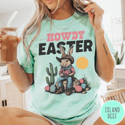 Comfort Colors tee in Island Reef featuring western design style cowboy bunny sitting on a rock with cactus