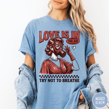 Comfort Colors tee in Washed Denim featuring retro graphic design of a woman wearing a gas mask