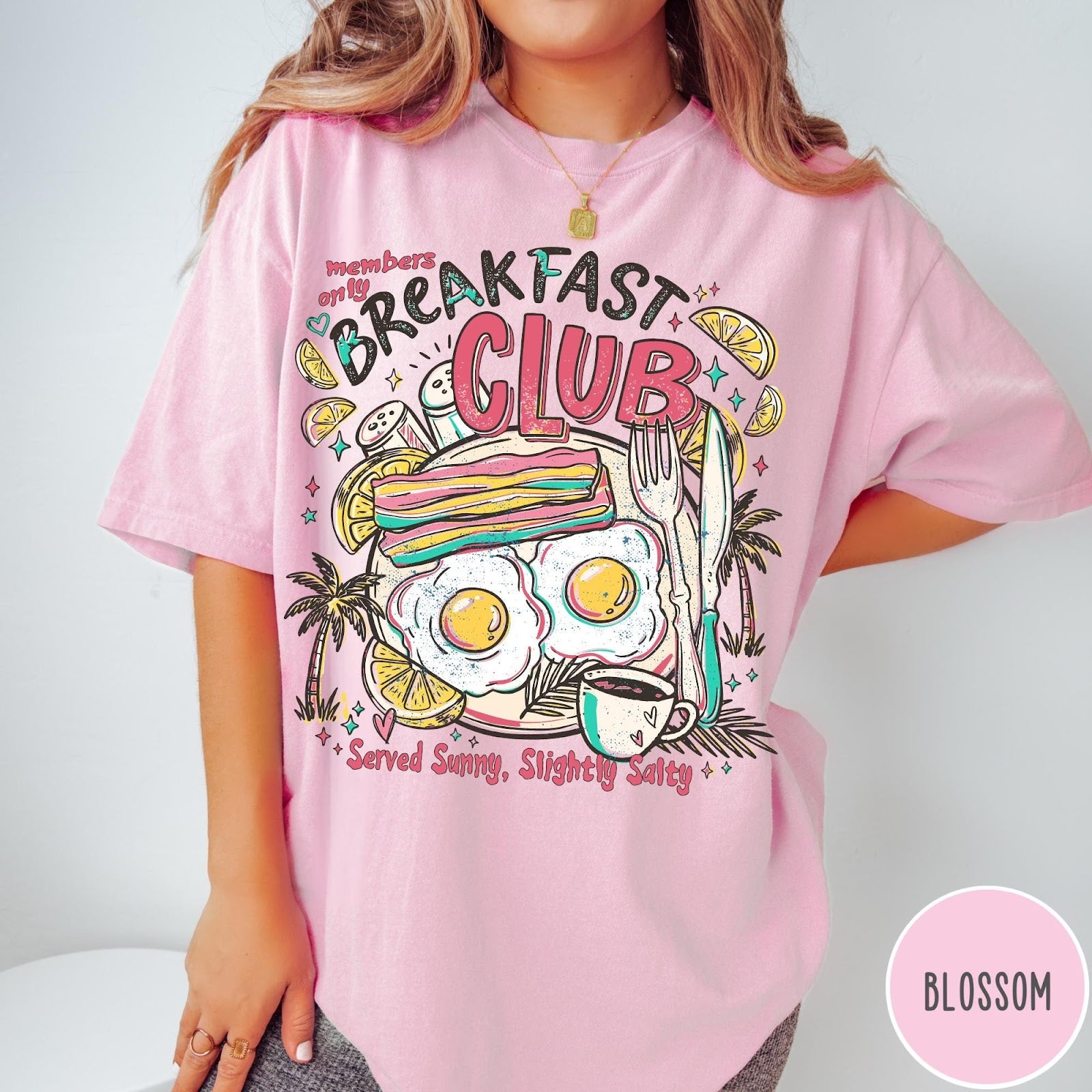 Comfort Colors tee in Blossom featuring retro breakfast food graphic with eggs, bacon, and coffee illustration