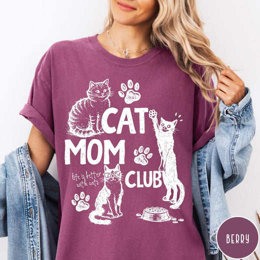 Comfort Colors tee in Berry featuring vintage style graphic with cats, paw prints, and cat mom club text