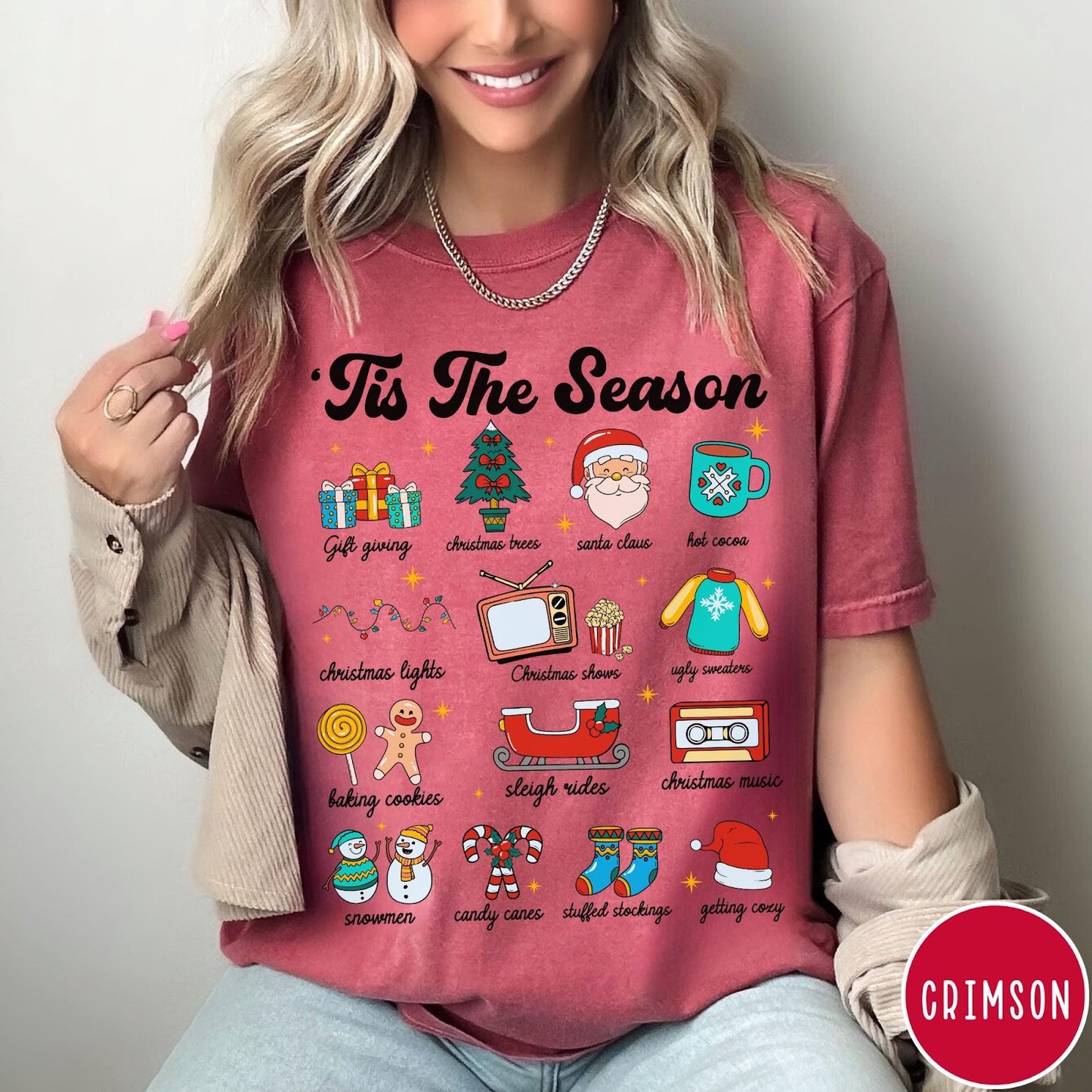 Comfort Colors tee in Crimson featuring holiday icons graphic with Christmas trees, Santa, and festive seasonal imagery