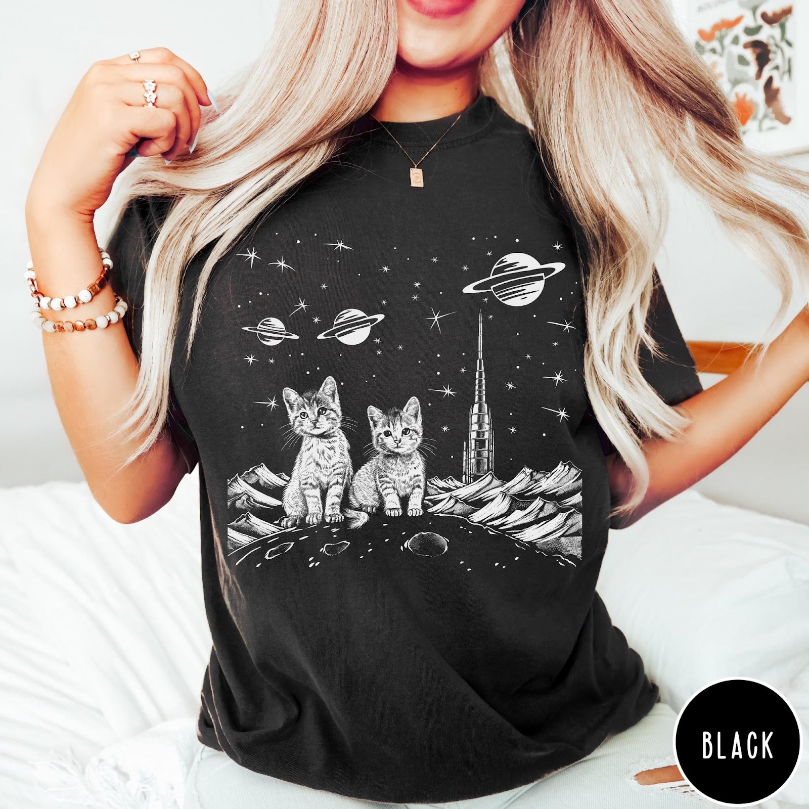 Comfort Colors tee in Black featuring line art graphic of two kittens sitting on a planet with rocket