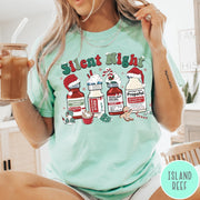 Comfort Colors tee in Island Reef featuring holiday graphic with medical vials styled as festive holiday treats