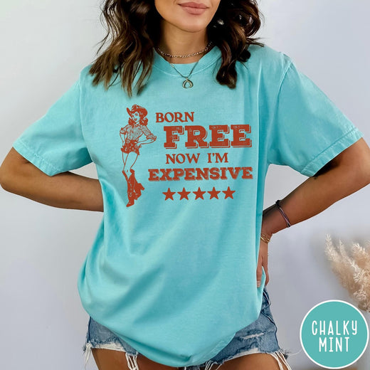 Comfort Colors tee in Chalky Mint featuring cowgirl design with Born Free Now I'm Expensive text and stars