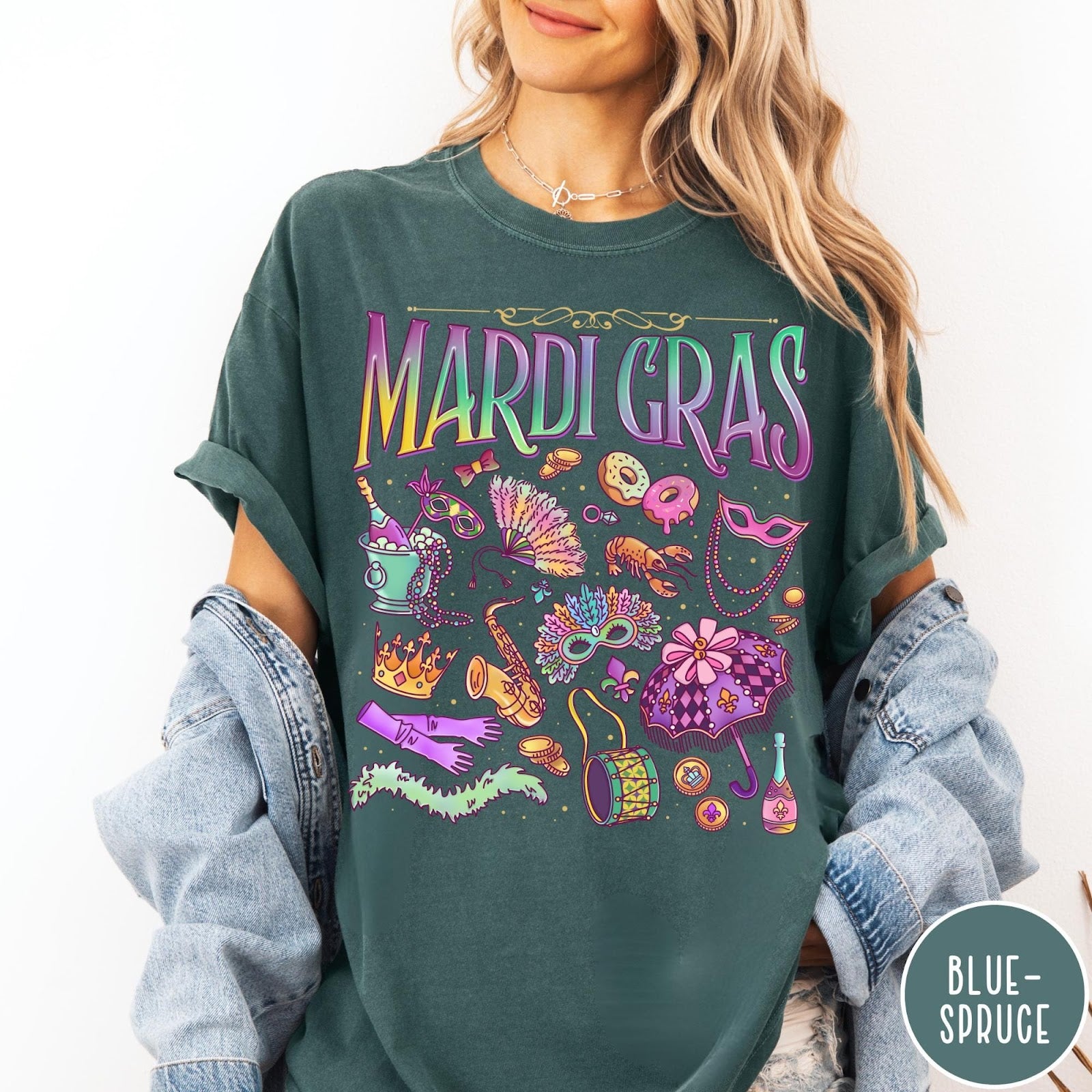 Comfort Colors tee in Blue Spruce featuring vintage style Mardi Gras icons including a saxophone, mask, and umbrella.