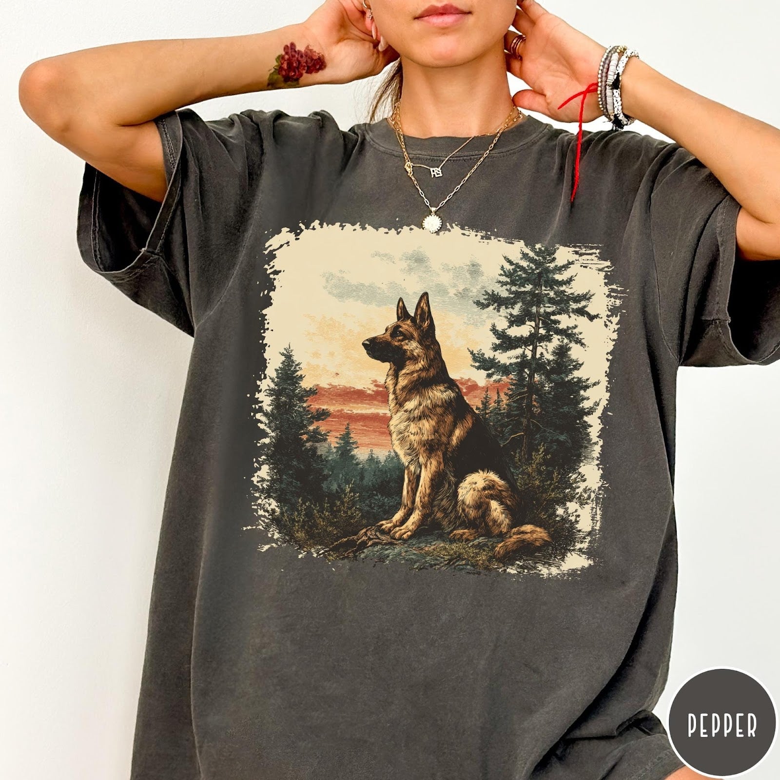 Comfort Colors tee in Pepper featuring vintage style graphic of a German Shepherd sitting in a forest