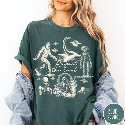 Comfort Colors tee in Blue Spruce featuring vintage style graphic of Bigfoot, Loch Ness Monster, aliens, and UFOs